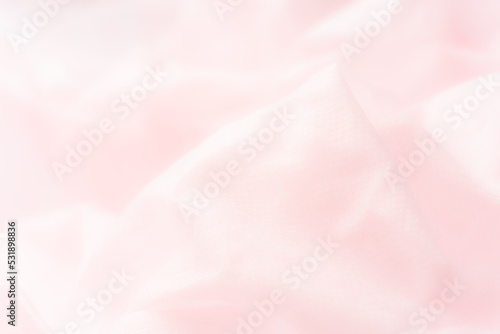ふわふわピンクの布の背景素材