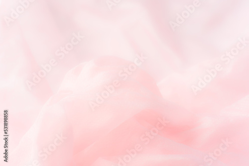 ふわふわピンクの布の背景素材