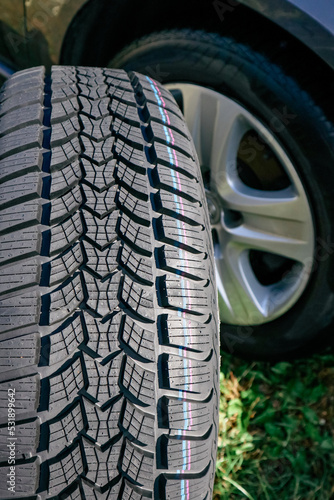 Car winter tire texture plan. tread pattern. rubber wheels for winter. Closeup of car tires © Trik