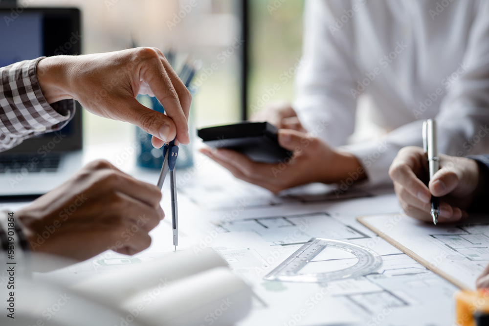 Architects and engineers are working together to edit the draft house plan that was designed after it was presented to the client and partially revised the design. Interior design and decoration ideas