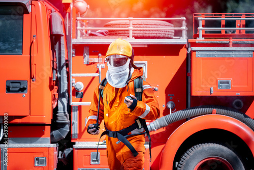 Firefighter man wearing protective fire suite and helmet with equipment and accessories is fire safety accident protection is industry safety concept.