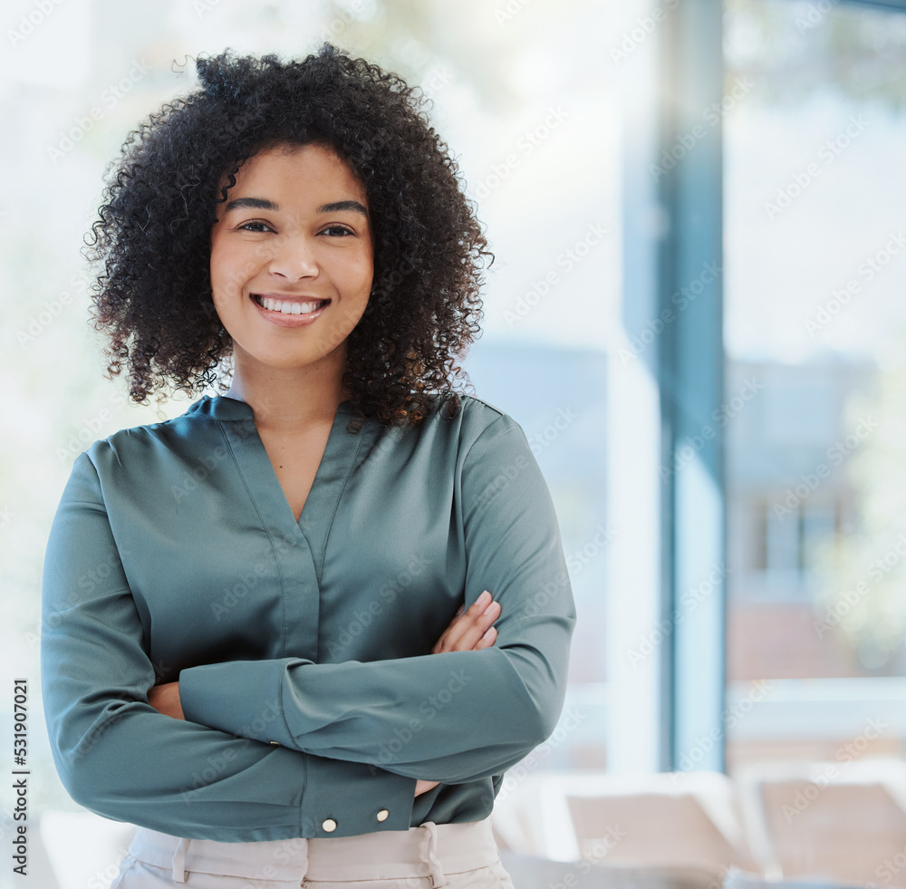 Happy human resources manager smile, leadership and vision for success. Portrait of a black business woman standing arms crossed, smiling and feeling positive while working in an startup office Happy human resources manager smile, leadership and vision for success. Portrait of a black business woman standing arms crossed, smiling and feeling positive while working in an startup office