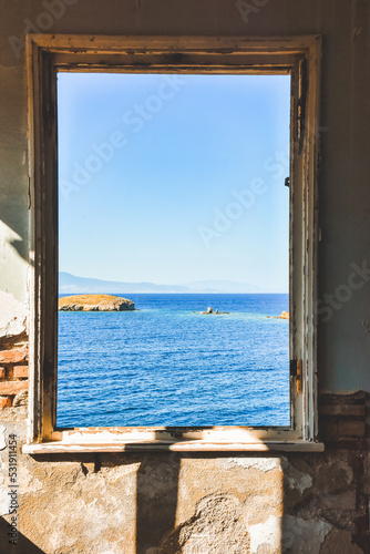Window to the sea in an abandoned house and across the islands  the Aegean sea  Fo  a  Phokai  IzmirTurkey