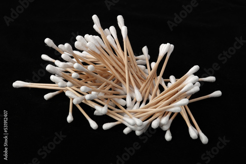 cotton swabs isolated on black photo