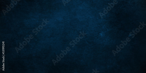 Dark Blue background with grunge backdrop texture, watercolor painted mottled blue background, colorful bright ink and watercolor textures on black paper background.