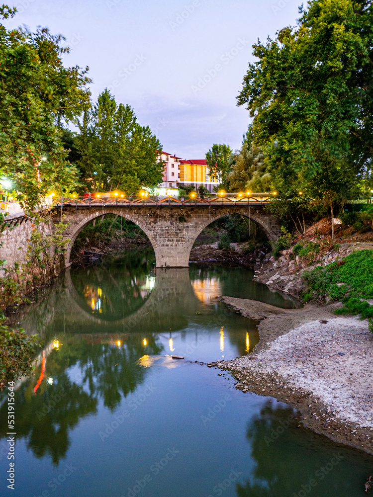 Fototapeta premium bridge over the river at sunset