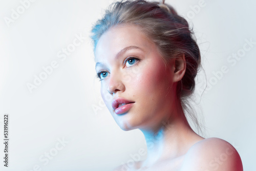 Fashion portrait of woman with natural pink make-up, clean skin and white teeth on white background