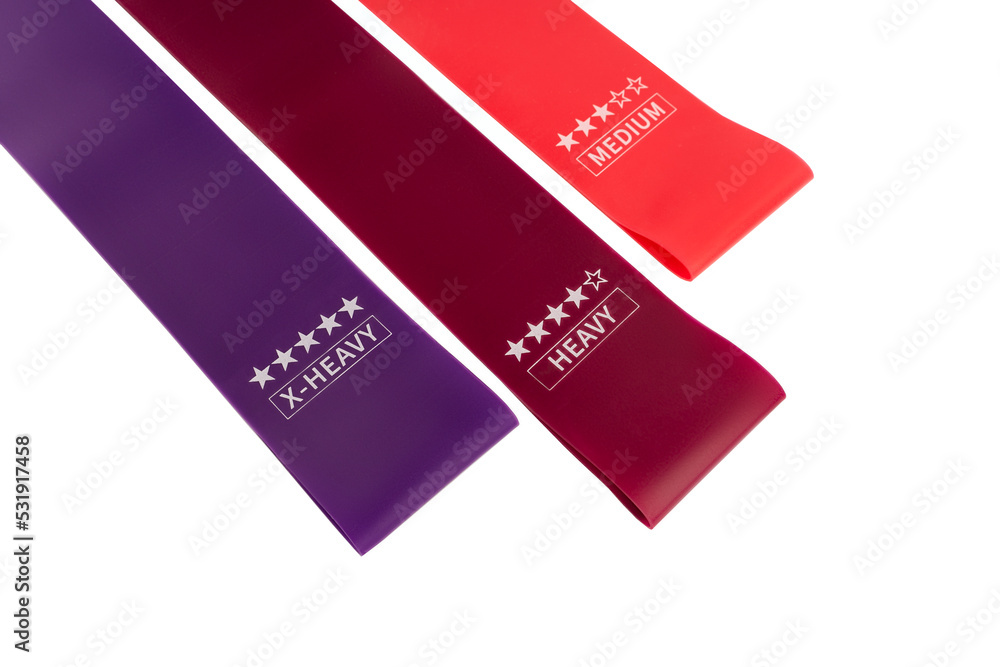 fitness elastic band. Woman showing a blue rubber band. Sport and healthy active lifestyle concept. A set of colorful elastic fitness band. fitness elastic band. Woman showing a blue rubber band. Sport and healthy active lifestyle concept. A set of colorful elastic fitness band.