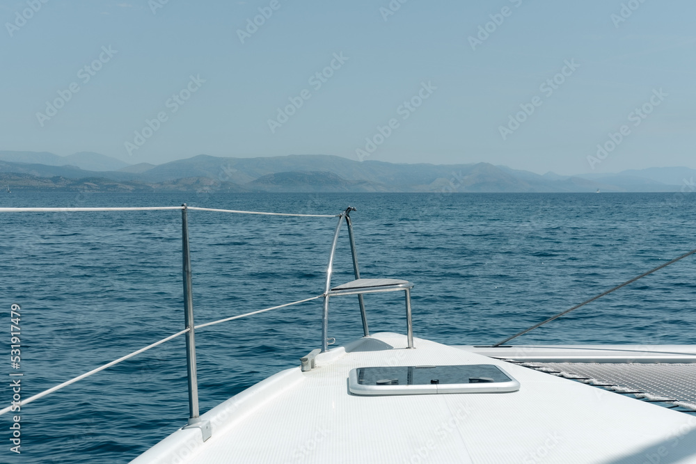 Fototapeta premium sailing catamaran front deck when cruising, amazing seascape, holiday on boat, travelling around the world