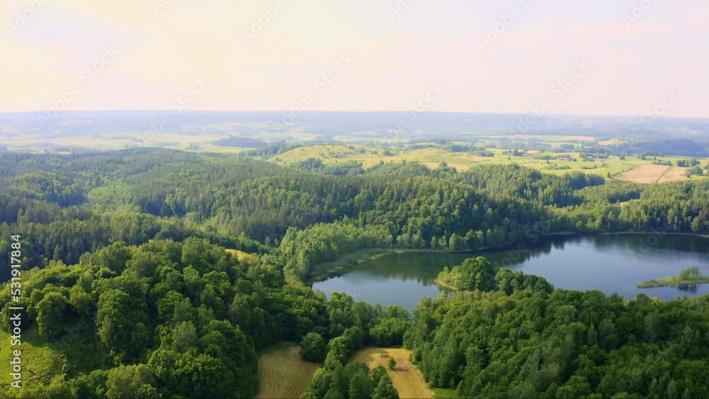 Aerial view of lake landscape in Poland under strong sunlight Aerial view of lake landscape in Poland under strong sunlight