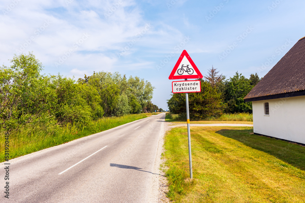 Crossing Cyclists Warning Sign along the road in Jutland, Denmark on summer day