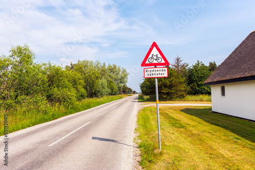 Obraz na płótnie Crossing Cyclists Warning Sign along the road in Jutland, Denmark on summer day w salonie