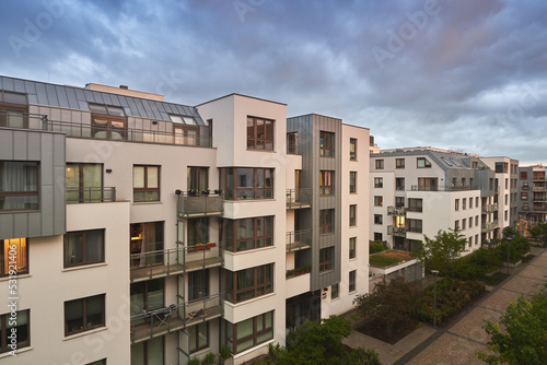 Contemporary resident complex in Europe during summer evening. Concept of happy living in the modern house. Owning a real estate concept.