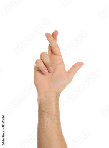 Man with crossed fingers on white background, closeup. Superstition concept © New Africa