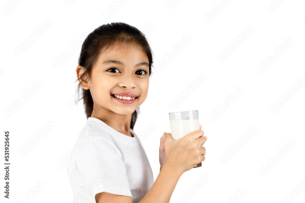 Young Asian girl in white T-shirt holding a glass of milk and smiling isolated on a white background with clipping path. Young Asian girl in white T-shirt holding a glass of milk and smiling isolated on a white background with clipping path.