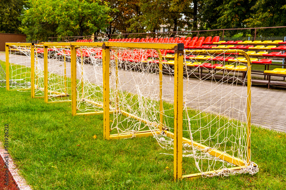 Small soccer goals lined up on a stadium