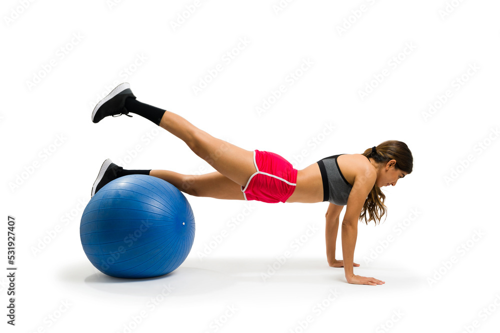 Sporty latin woman working out during her cross training routine Sporty latin woman working out during her cross training routine