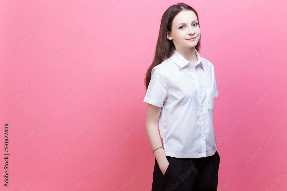 Winsome Teenager Girl Wearing White Shirt Posing with Hands in Pockets Isolated Over Vivid Pink Background with Happy Smiling Face Standing With Confidence Winsome Teenager Girl Wearing White Shirt Posing with Hands in Pockets Isolated Over Vivid Pink Background with Happy Smiling Face Standing With Confidence