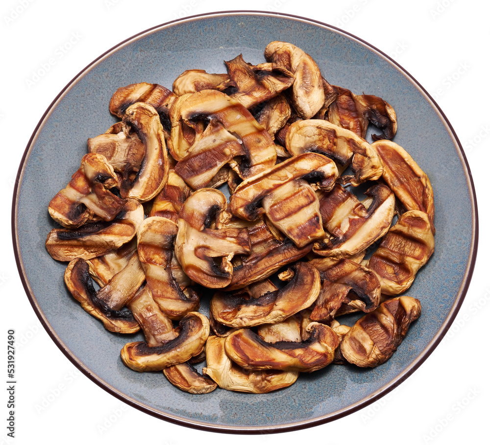 Grilled Slices of champignon mushrooms with stripes from a grill in ceramic plate Grilled Slices of champignon mushrooms with stripes from a grill in ceramic plate