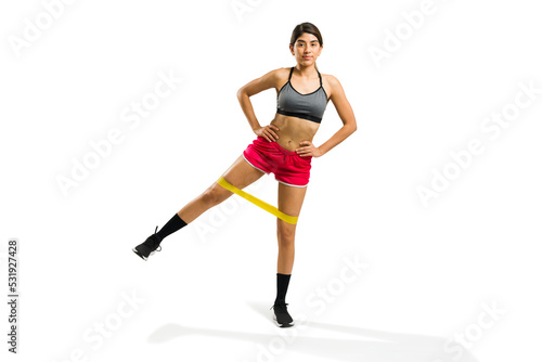 Beautiful young woman with a fitness lifestyle exercising in full length