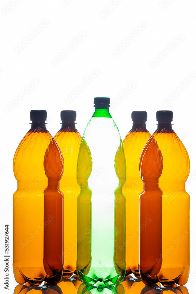 Ecological Concepts. Various Empty Colorful Plastic Garbage Bottles In Line Together Over White Background. Ecological Concepts. Various Empty Colorful Plastic Garbage Bottles In Line Together Over White Background.