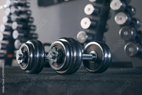 Rows of dumbbells in the gym Close up of modern dumbbells equipment in the sport gym, gym equipment concept