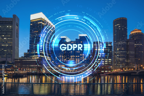 Fototapeta Naklejka Na Ścianę i Meble -  City view panorama of Boston Harbour and Seaport Blvd at night time, Massachusetts. Building exteriors of financial downtown. GDPR hologram is data protection regulation, privacy for all individuals
