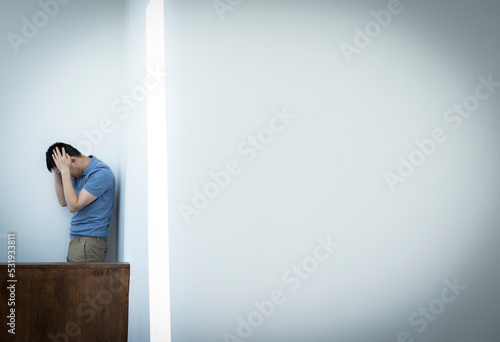 Frustrated businessman with head in hands photo