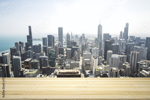Blank wooden tabletop with beautiful Chicago skyline at daytime on background  mockup