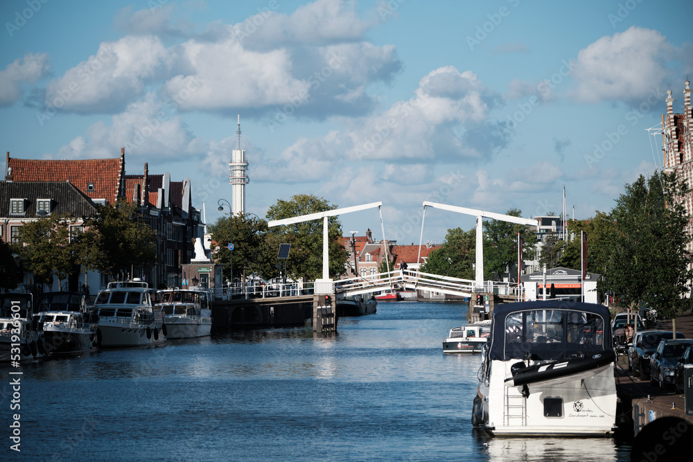 Netherlands canal with boats and bridge 