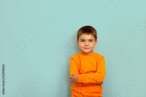 portrait of a child on a light blue background copy space. portrait of a little boy 5 years old