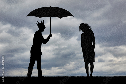 Selfishness and sexism. Selfish man with a crown holding an umbrella laughs at an upset woman in the rain