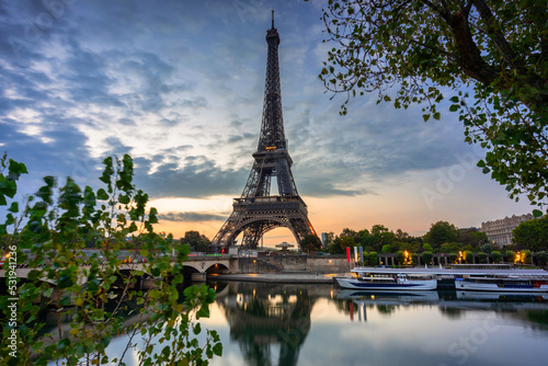 Fototapeta Naklejka Na Ścianę i Meble -  Eiffel Tower by the Seine River in Paris at sunrise. France