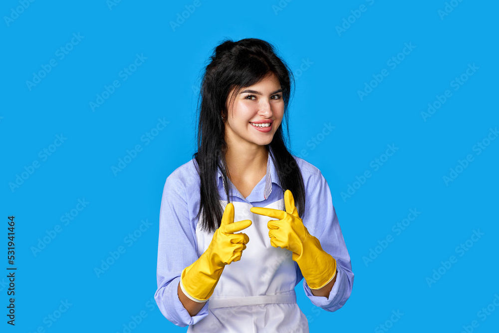 woman in gloves and cleaner apron pointing fingers to camera woman in gloves and cleaner apron pointing fingers to camera