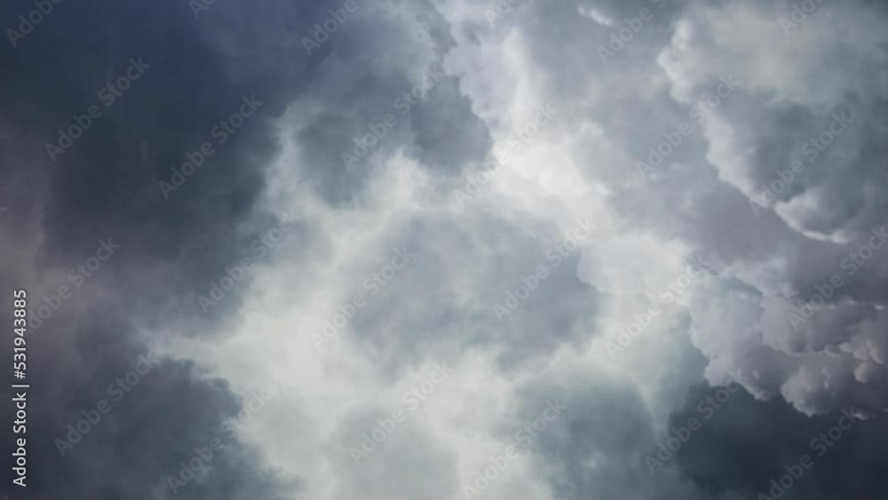 view of lightning flashes inside dark clouds in the sky. view of lightning flashes inside dark clouds in the sky.