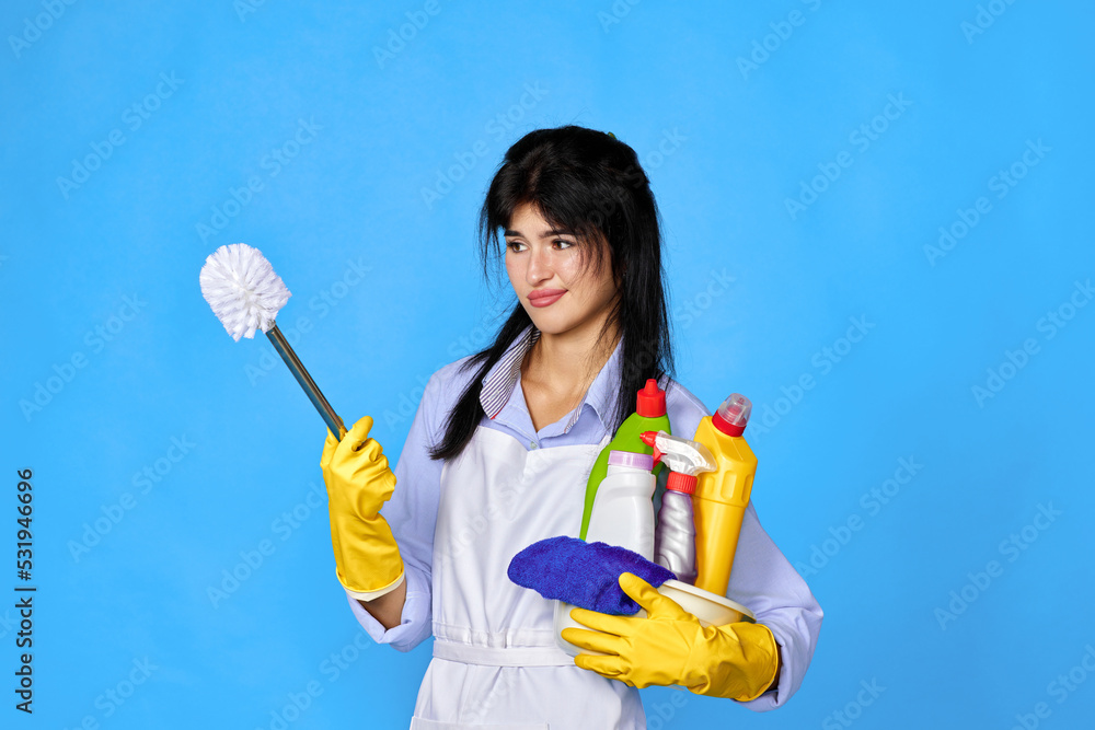 woman in gloves holding bucket of detergents woman in gloves holding bucket of detergents