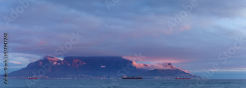View of Table Mountain at dusk from Bloubergstrand, Cape Town. Western Cape. South Africa.  photo