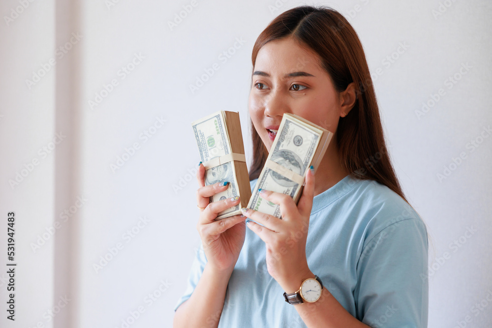 Asian woman hand holding money saving money financial planning. Asian woman hand holding money saving money financial planning.