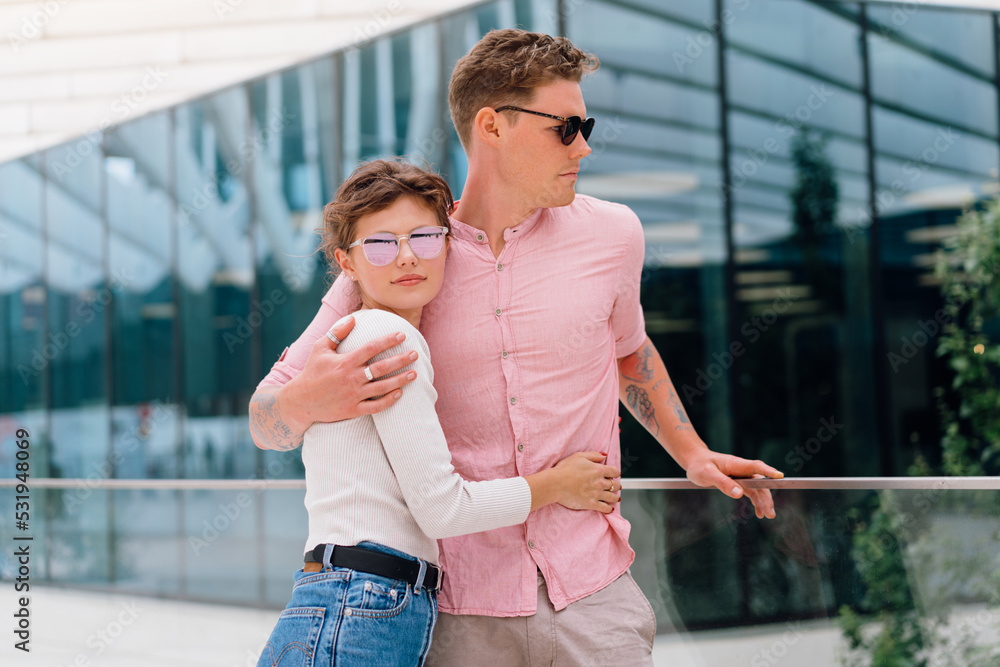Happy cheerful couple in sunglasses Happy cheerful couple in sunglasses