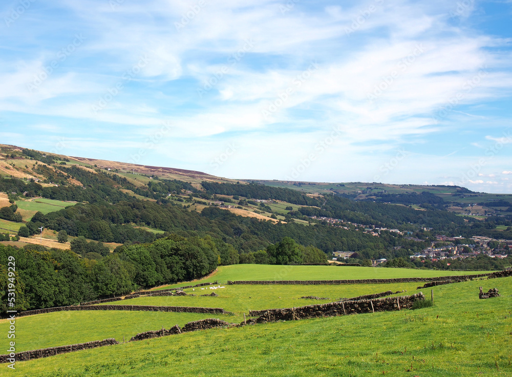 view of the calder valley in calderdale west yorkshire with the village of mytholmroyd visible in the distance