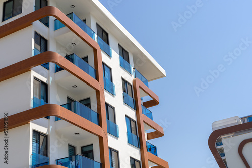 Residential apartment building. Blue sky.