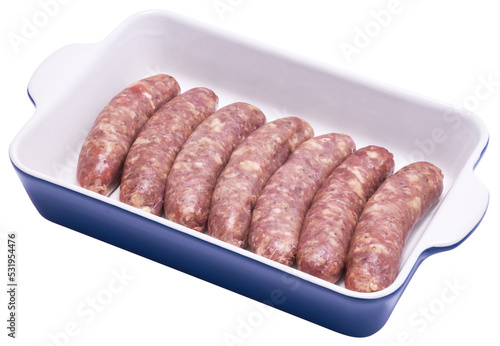 Raw beef or pork grill sausage in baking dish isolated