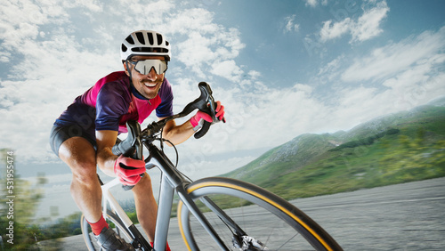 Portrait of cheerful man, professional cyclist training, riding on sport bike around nature landscape