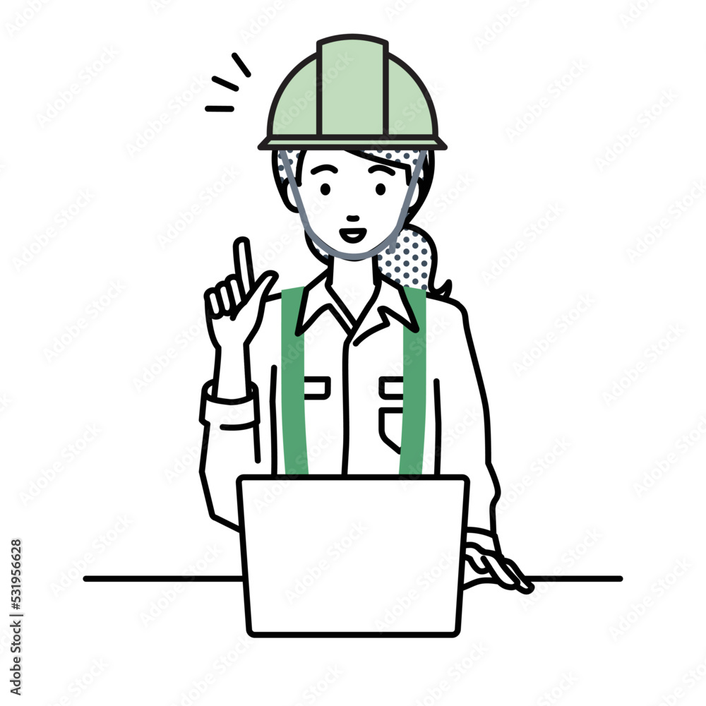 デスクで座ってPCを開いて何かひらめいた工事現場の女性