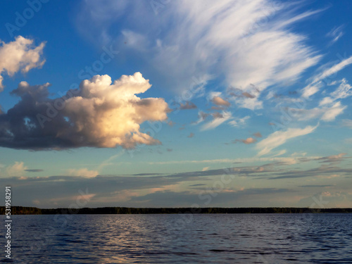 Image of the river, clouds in the sky, the horizon. Natural natural background. The concept of clean fresh air.