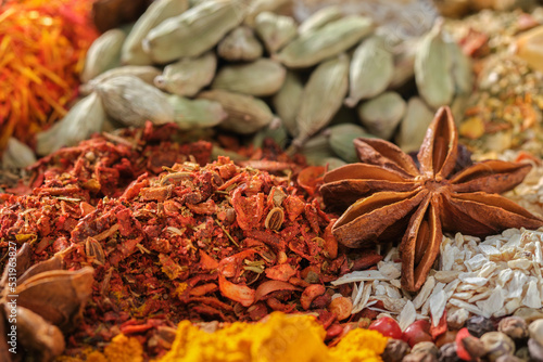 Spices. Aromatic Indian spices on a slate background. Spices and herbs on a stone background. Assortment of Seasonings, condiments, Dry colorful condiments. Culinary, cooking ingredients