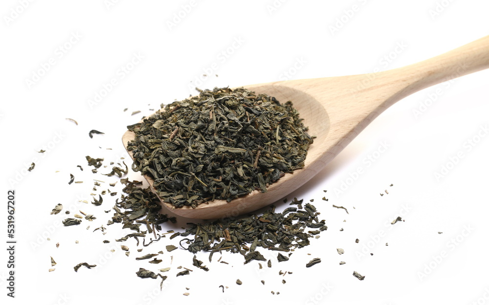 Green tea pile in wooden spoon isolated on white Green tea pile in wooden spoon isolated on white
