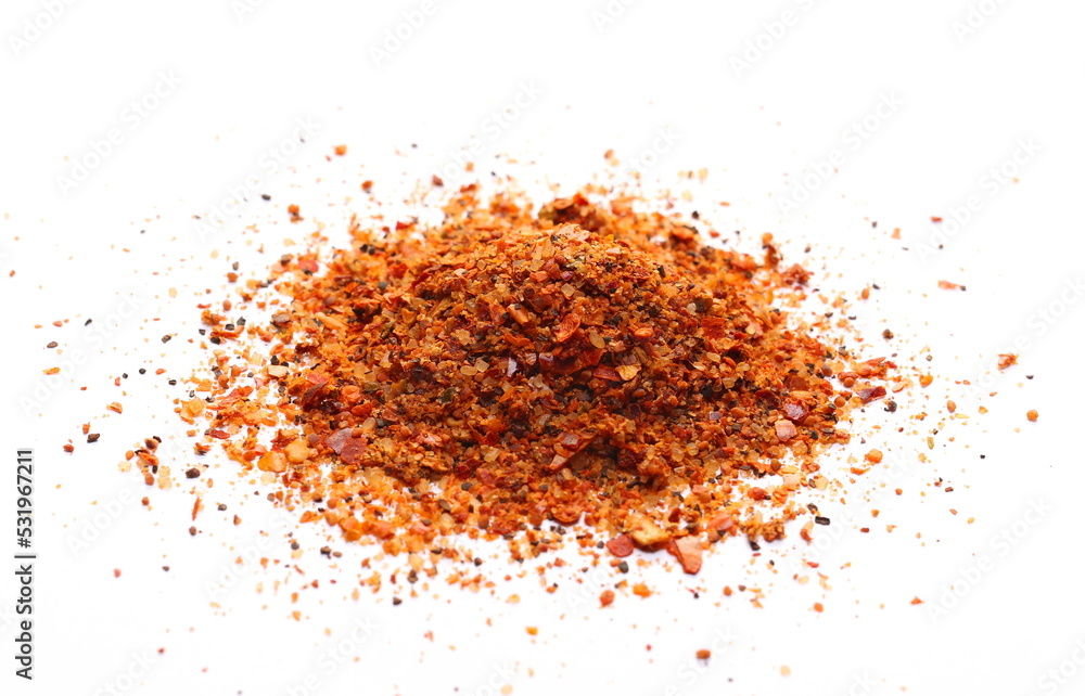 Seasoning preparation, mild hot powder mixture, with spices and tomatoes, (black pepper, garlic, cane sugar, granulated tomatoes, cayenne pepper, sea salt) isolated on white Seasoning preparation, mild hot powder mixture, with spices and tomatoes, (black pepper, garlic, cane sugar, granulated tomatoes, cayenne pepper, sea salt) isolated on white
