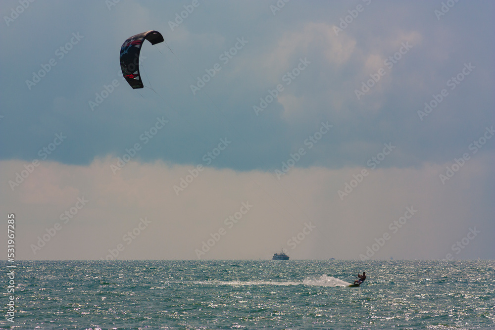 riding the kite in the sea on the waves