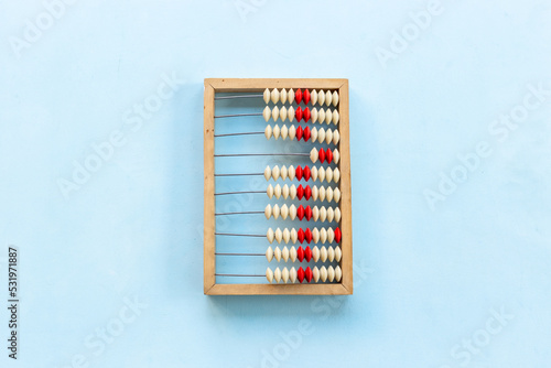 Education or business concept. Vintage accounting wooden abacus